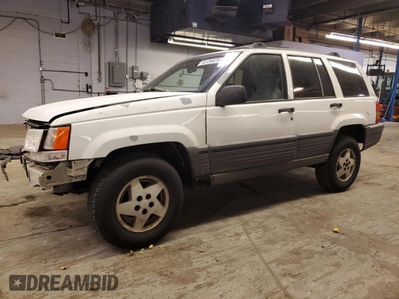 1993 Jeep Grand Cherokee Laredo with VIN 1J4GZ58SXPC554642, listed as a Copart auction lot 83268254 with 266,063 mi miles and Salvage Title. Bid and sale history available at carsss.com. Image 1.