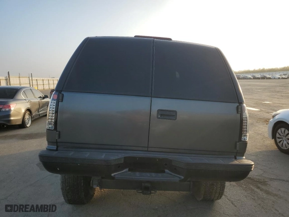 1999 Chevrolet Tahoe with VIN 1GNEC13R0XJ495650, listed as a Copart auction lot 85348144 with 0 mi miles and Salvage Title. Bid and sale history available at carsss.com. Image 6.