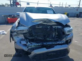 2021 Toyota Tacoma SR with VIN 5TFCZ5AN6MX270972, listed as a IAAI auction lot 42460823 with 76,062 mi miles and . Bid and sale history available at DreamBid. Image 13.