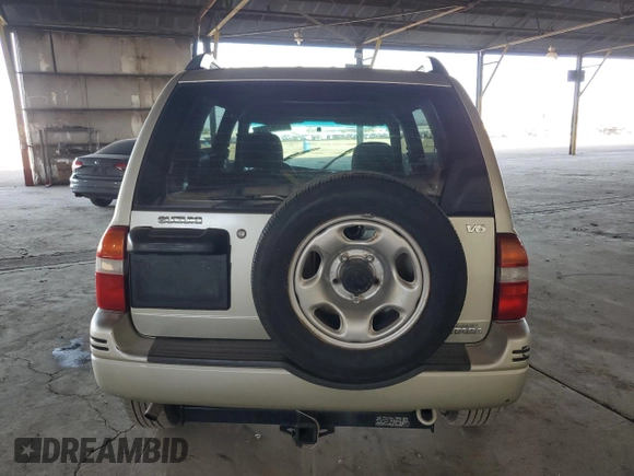1999 Suzuki Grand Vitara JLX z VIN JS3TD62V3X4123048, wystawiony jako Copart lot #73007124 z przebiegiem 159 828 mil mil oraz Szkoda całkowita • Salvage title. Historia ofert i sprzedaży dostępna na DreamBid. Obrazek 6.