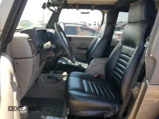 2004 Jeep Wrangler Rubicon with VIN 1J4FA69S64P751349, listed as a Copart auction lot 69642624 with 160,589 mi miles and Salvage Title. Bid and sale history available at carsss.com. Image 7.