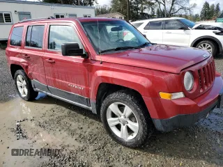 2014 Jeep Patriot Latitude with VIN 1C4NJRFB1ED651525, listed as a Copart auction lot 52526975 with 135,088 mi miles and Salvage Title. Bid and sale history available at carsss.com. Image 4.