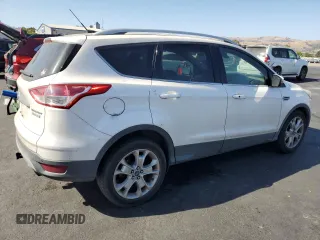 2014 Ford Escape Titanium z VIN 1FMCU0J9XEUD01904, wystawiony jako Copart lot #61819555 z przebiegiem 217 794 mil mil oraz Czysty tytuł • Clean title. Historia ofert i sprzedaży dostępna na DreamBid. Obrazek 3.