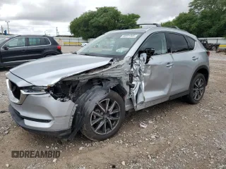 2018 Mazda CX-5 Grand Touring with VIN JM3KFBDM0J0323215, listed as a Copart auction lot 58591945 with 93,082 mi miles and Salvage title. Bid and sale history available at DreamBid. Image 1.