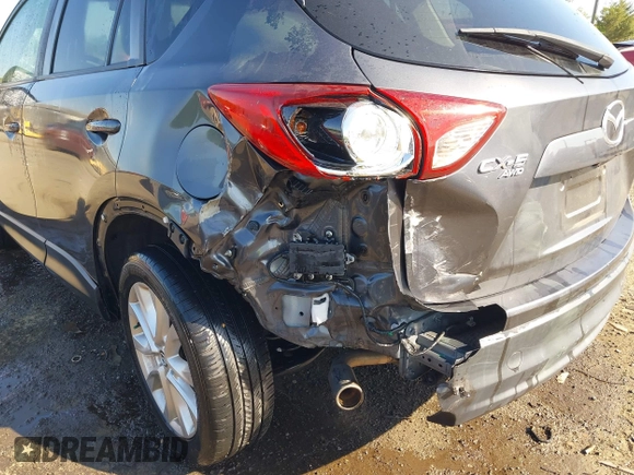 2014 Mazda CX-5 Grand Touring with VIN JM3KE4DY2E0312952, listed as a IAAI auction lot 42138721 with 99,993 mi miles and . Bid and sale history available at DreamBid. Image 17.
