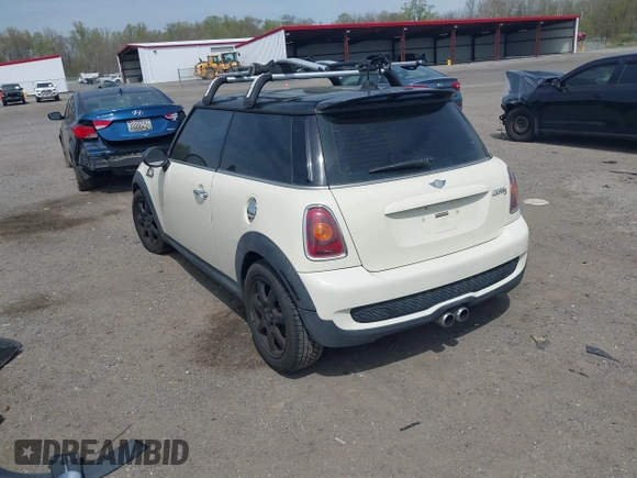 2007 MINI Hardtop S with VIN WMWMF73547TV31403, listed as a IAAI auction lot 42066433 with 156,730 mi miles and . Bid and sale history available at DreamBid. Image 3.