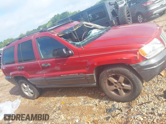 2004 Jeep Grand Cherokee Laredo with VIN 1J4GW48S34C419596, listed as a IAAI auction lot 42515494 with 276,196 mi miles and . Bid and sale history available at DreamBid. Image 13.