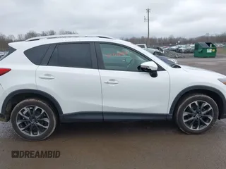 2016 Mazda CX-5 Grand Touring z VIN JM3KE4DY0G0705884, wystawiony jako IAAI lot #42016910 z przebiegiem 73 324 mil mil oraz . Historia ofert i sprzedaży dostępna na DreamBid. Obrazek 13.