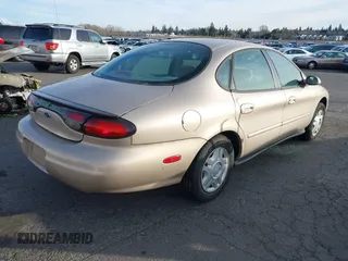 1999 Ford Taurus SE with VIN 1FAFP53U4XG223246, listed as a IAAI auction lot 41570969 with 59,064 mi miles. Bid and sale history available at carsss.com. Image 4.