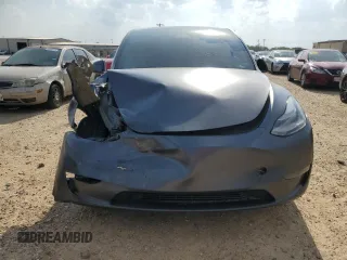 2022 Tesla Model Y Performance with VIN 7SAYGDEF2NF460730, listed as a Copart auction lot 54127945 with 59,735 mi miles and Salvage title. Bid and sale history available at DreamBid. Image 5.