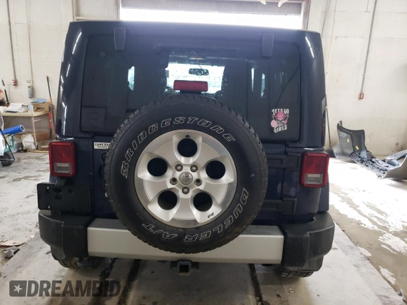 2013 Jeep Wrangler Sahara z VIN 1C4AJWBG4DL504800, wystawiony jako Copart lot #60504575 z przebiegiem 166 687 mil mil oraz Szkoda całkowita • Salvage title. Historia ofert i sprzedaży dostępna na DreamBid. Obrazek 6.