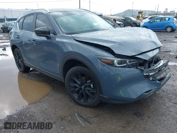 2024 Mazda CX-5 S Carbon Edition z VIN JM3KFBCL1R0470051, wystawiony jako IAAI lot #42088186 z przebiegiem 10 285 mil mil oraz . Historia ofert i sprzedaży dostępna na DreamBid. Obrazek 1.