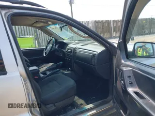 2003 Jeep Grand Cherokee Laredo with VIN 1J4GW48S83C558962, listed as a IAAI auction lot 42415803 with 312,419 mi miles and . Bid and sale history available at DreamBid. Image 5.
