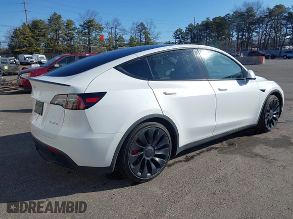 2023 Tesla Model Y Performance with VIN 7SAYGDEF3PF711497, listed as a IAAI auction lot 41877450 with 21,887 mi miles and . Bid and sale history available at DreamBid. Image 4.