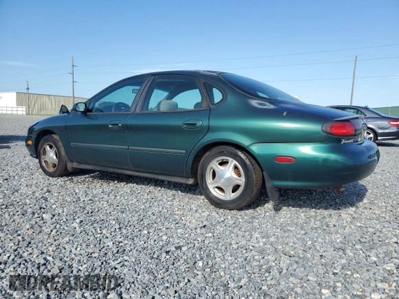 1999 Ford Taurus SE with VIN 1FAFP53U2XG184723, listed as a Copart auction lot 60787115 with 128,277 mi miles and Salvage title. Bid and sale history available at DreamBid. Image 2.