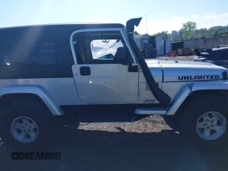 2005 Jeep Wrangler Unlimited with VIN 1J4FA44S55P352803, listed as a IAAI auction lot 42688284 with 128,586 mi miles and . Bid and sale history available at DreamBid. Image 13.