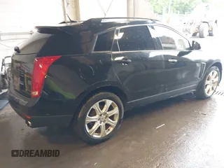 2014 Cadillac SRX Performance Collection with VIN 3GYFNFE39ES659013, listed as a IAAI auction lot 42264069 with 129,122 mi miles and . Bid and sale history available at DreamBid. Image 4.