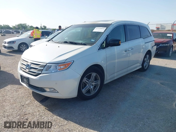 2012 Honda Odyssey Touring with VIN 5FNRL5H93CB125241, listed as a IAAI auction lot 42299053 with 125,549 mi miles and . Bid and sale history available at DreamBid. Image 2.