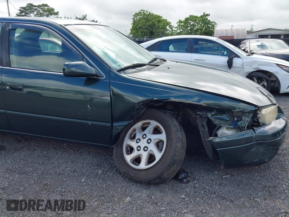 1999 Toyota Camry LE z VIN JT2BF22K2X0164080, wystawiony jako IAAI lot #40984874 z przebiegiem Nie podano mil oraz . Historia ofert i sprzedaży dostępna na DreamBid. Obrazek 12.