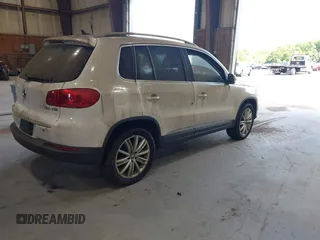 2012 Volkswagen Tiguan SE with VIN WVGAV7AXXCW533237, listed as a IAAI auction lot 42670923 with 227,323 mi miles and . Bid and sale history available at DreamBid. Image 4.