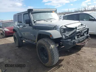 2014 Jeep Wrangler Unlimited Rubicon X with VIN 1C4HJWFG9EL233680, listed as a IAAI auction lot 41395223 with 106,979 mi miles and . Bid and sale history available at DreamBid. Image 1.
