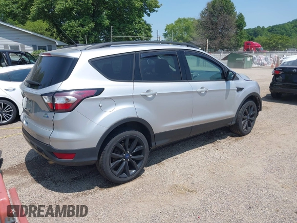 2017 Ford Escape SE z VIN 1FMCU9G95HUD37371, wystawiony jako IAAI lot #42393304 z przebiegiem 76 039 mil mil oraz . Historia ofert i sprzedaży dostępna na DreamBid. Obrazek 4.