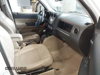 2014 Jeep Patriot Latitude with VIN 1C4NJPFA0ED680509, listed as a IAAI auction lot 41801775 with 147,418 mi miles and . Bid and sale history available at carsss.com. Image 5.