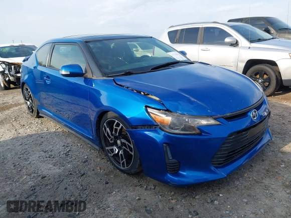 2014 Scion tC with VIN JTKJF5C72E3086001, listed as a IAAI auction lot 41721986 with 207,239 mi miles. Bid and sale history available at carsss.com. Image 1.