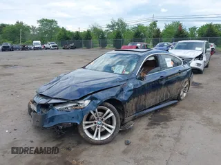 2016 BMW 4 Series 428i with VIN WBA4A9C52GGL88003, listed as a IAAI auction lot 42225642 with 105,054 mi miles and . Bid and sale history available at DreamBid. Image 2.