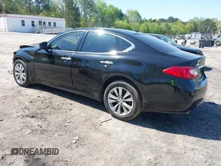 2012 Infiniti M with VIN JN1BY1AR1CM392880, listed as a IAAI auction lot 42012317 with 106,000 mi miles and . Bid and sale history available at DreamBid. Image 3.