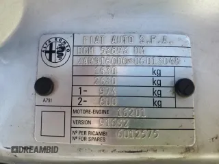 1996 Alfa Romeo Spider z VIN ZAR91600006013048, wystawiony jako Copart lot #62495174 z przebiegiem 143 888 mil mil oraz Szkody całkowita. Historia ofert i sprzedaży dostępna na DreamBid. Obrazek 13.