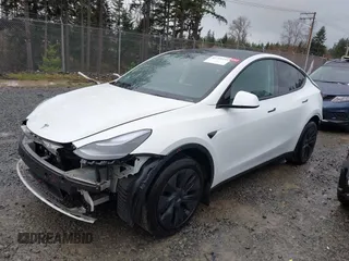 2025 Tesla Model Y Long Range with VIN 7SAYGDEDXSF248734, listed as a IAAI auction lot 41719195 with 5,876 mi miles and . Bid and sale history available at DreamBid. Image 14.