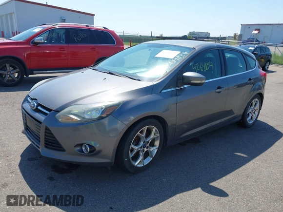 2014 Ford Focus Titanium with VIN 1FADP3N22EL317007, listed as a IAAI auction lot 42641134 with 159,705 mi miles and . Bid and sale history available at DreamBid. Image 2.