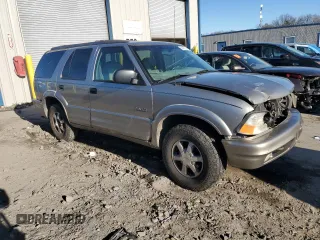 2000 Oldsmobile Bravada z VIN 1GHDT13WXY2255649, wystawiony jako Copart lot #80021214 z przebiegiem Nie podano mil oraz Szkody całkowita. Historia ofert i sprzedaży dostępna na DreamBid. Obrazek 4.