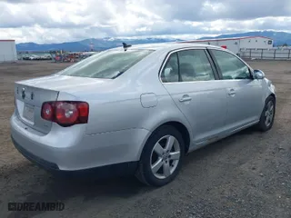 2009 Volkswagen Jetta Sedan SE with VIN 3VWRZ71K39M090645, listed as a IAAI auction lot 41999413 with 244,687 mi miles. Bid and sale history available at carsss.com. Image 4.