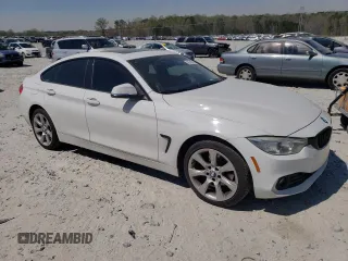 2015 BMW 4 Series 428i xDrive with VIN WBA4A7C50FD415218, listed as a Copart auction lot 50745555 with 139,343 mi miles and Salvage title. Bid and sale history available at DreamBid. Image 4.