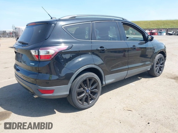 2017 Ford Escape SE with VIN 1FMCU0G9XHUE37185, listed as a IAAI auction lot 42053979 with 72,904 mi miles. Bid and sale history available at carsss.com. Image 4.