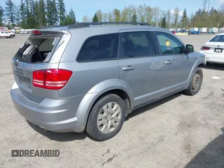 2016 Dodge Journey SE with VIN 3C4PDCAB2GT102871, listed as a IAAI auction lot 42009827 with 197,646 mi miles. Bid and sale history available at carsss.com. Image 4.