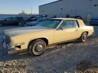 1985 Cadillac Eldorado z VIN 1G6EL5781FE647818, wystawiony jako Copart lot #77608224 z przebiegiem 7192 mil mil oraz Tytuł czysty. Historia ofert i sprzedaży dostępna na DreamBid. Obrazek 1.
