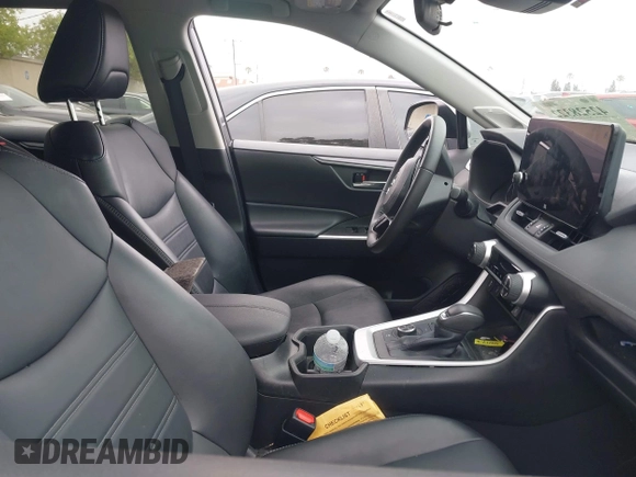 2023 Toyota RAV4 Hybrid XLE Premium with VIN 4T3B6RFV9PU117919, listed as a IAAI auction lot 42528322 with 27,236 mi miles and . Bid and sale history available at DreamBid. Image 5.
