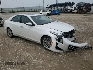 2015 Cadillac CTS Luxury AWD with VIN 1G6AX5SX8F0129784, listed as a Copart auction lot 64955525 with 122,995 mi miles and Clean title. Bid and sale history available at DreamBid. Image 4.