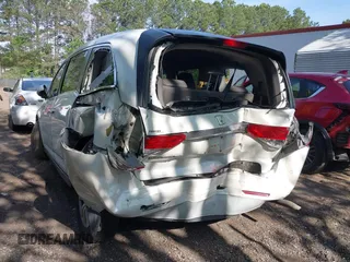2014 Honda Odyssey EX-L with VIN 5FNRL5H63EB064854, listed as a IAAI auction lot 42102704 with 148,536 mi miles and . Bid and sale history available at carsss.com. Image 6.
