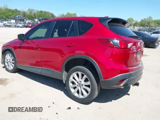 2015 Mazda CX-5 Grand Touring with VIN JM3KE4DY5F0469439, listed as a IAAI auction lot 42053851 with 70,676 mi miles. Bid and sale history available at carsss.com. Image 3.