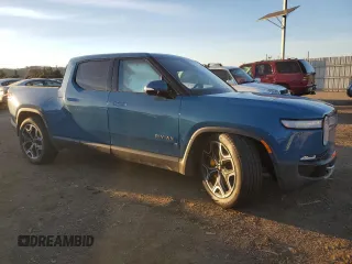 2022 Rivian R1T Launch Edition with VIN 7FCTGAAL5NN001219, listed as a Copart auction lot 86623924 with Not Provided miles and Salvage Title. Bid and sale history available at DreamBid. Image 4.