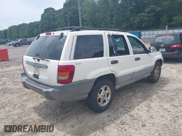 1999 Jeep Grand Cherokee Laredo with VIN 1J4GW58S3XC505985, listed as a IAAI auction lot 42399619 with 253,876 mi miles and . Bid and sale history available at DreamBid. Image 4.