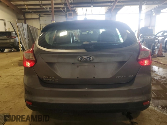2014 Ford Focus Titanium z VIN 1FADP3N27EL462950, wystawiony jako Copart lot #65207155 z przebiegiem 34 058 mil mil oraz Szkoda całkowita • Salvage title. Historia ofert i sprzedaży dostępna na DreamBid. Obrazek 6.