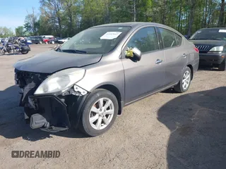 2014 Nissan Versa SV with VIN 3N1CN7AP2EL877539, listed as a IAAI auction lot 42107642 with 122,616 mi miles. Bid and sale history available at carsss.com. Image 2.
