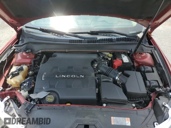 2014 Lincoln MKZ z VIN 3LN6L2GK4ER825465, wystawiony jako Copart lot #55911345 z przebiegiem 78 783 mil mil oraz Szkoda całkowita • Salvage title. Historia ofert i sprzedaży dostępna na DreamBid. Obrazek 11.