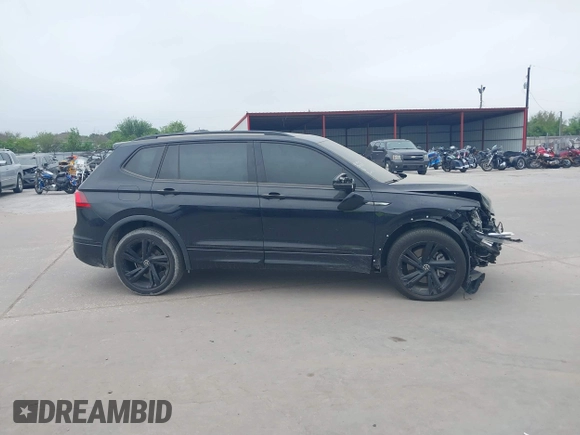2023 Volkswagen Tiguan SE R-Line Black with VIN 3VVCB7AX1PM106543, listed as a IAAI auction lot 41784559 with 39,846 mi miles and . Bid and sale history available at DreamBid. Image 14.