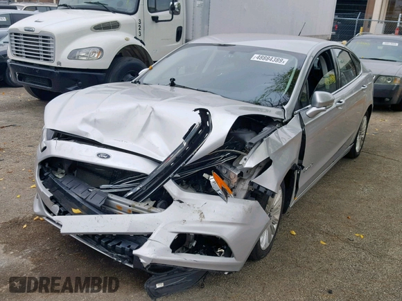 2016 Ford Fusion SE Hybrid with VIN 3FA6P0LUXGR397589, listed as a Copart auction lot 58180612 with 72,400 mi miles and Salvage Title. Bid and sale history available at carsss.com. Image 2.